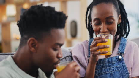 Happy,-black-couple-and-orange-juice-in-home