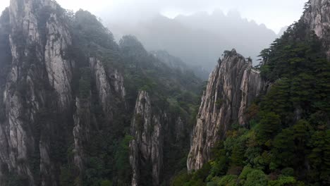 beautiful huangshan yellow mountain in foggy cloud cover, anhui china, aerial view