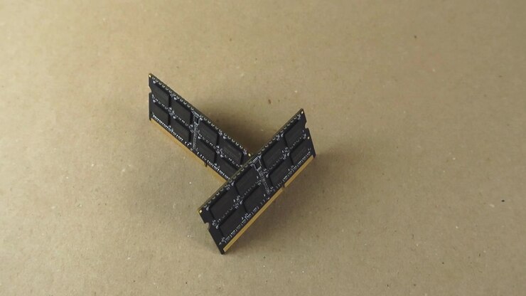 Two modern computer random access memory modules slowly rotating on a light brown background. Technological components for pc maintenance, repair and upgrade, improving system performance