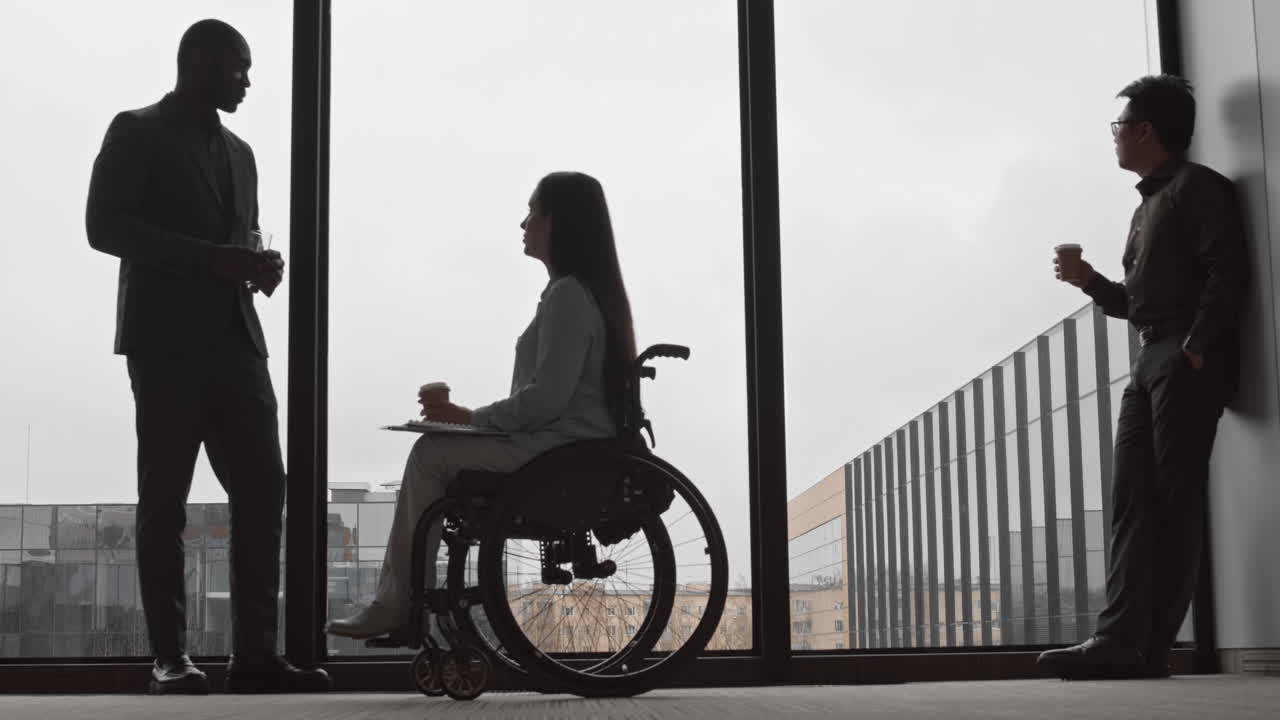 Businesswoman with Disability Having Chat with Male Colleague