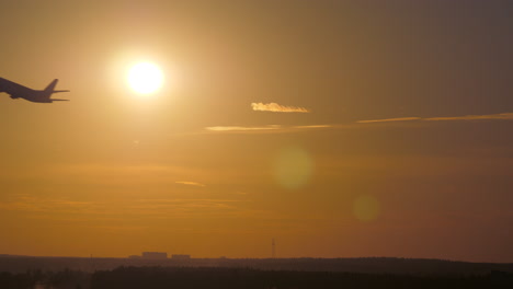 Airplane-takeoff-at-sunset