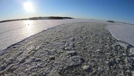 crushed and crack ice floats in the track of icebreaker ship sail in bothnian bay in lapland, finland. - aerial