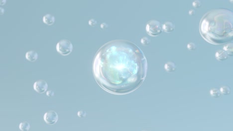 macro shot of various serum bubbles in water rising up on light blue background.