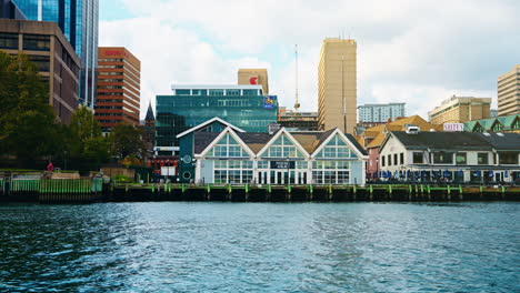 Boat tour exploring Halifax Downtown in Nova Scotia, Canada. Waterfront Skyline of the city. View of the financial district. Sightseeing of Halifax.