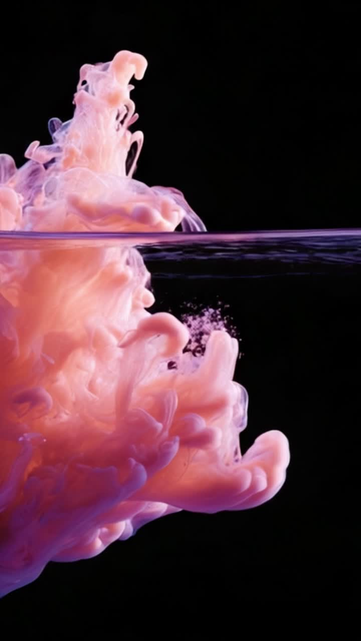 Vibrant Swirling Colors of Ink and Water Create Stunning Abstract Art in Motion, Capturing Beauty and Fluidity with a Bold Pink and Purple Palette