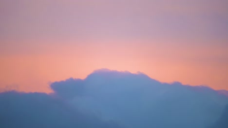 heavenly pink clouds gently moving across the sky