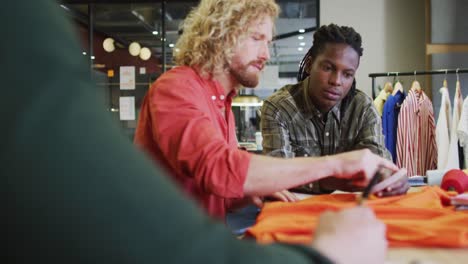 happy diverse business people discussing work during meeting at office