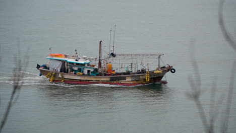 korean fishing boat cruising on sea near sinsido-ri island - high angle view