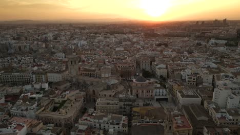 Opening-Aerial-view-of-Cathedral-and-Old-Historic-town-in-Valencia,-Spain,-during-Sunset