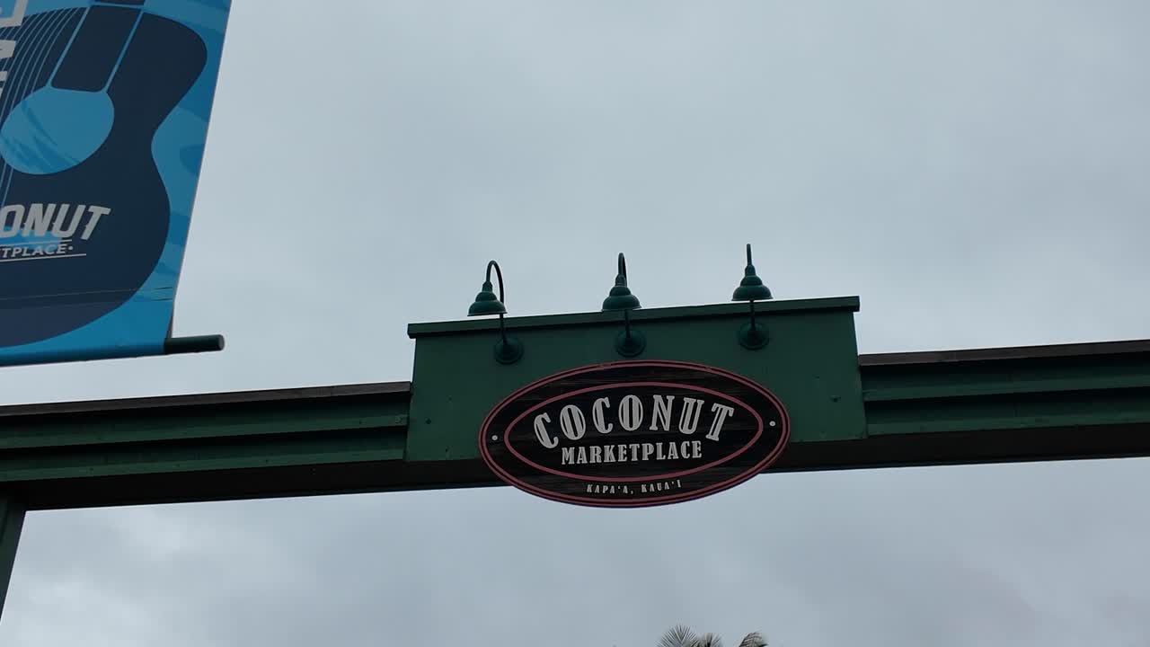 Signboard of Coconut Marketplace in Kapaa Kauai Hawaii, quaint open-air shopping village with stores, restaurants, coffeeshops and local art. Coconut Marketplace at Kapaa on the island of Kauai Hawaii