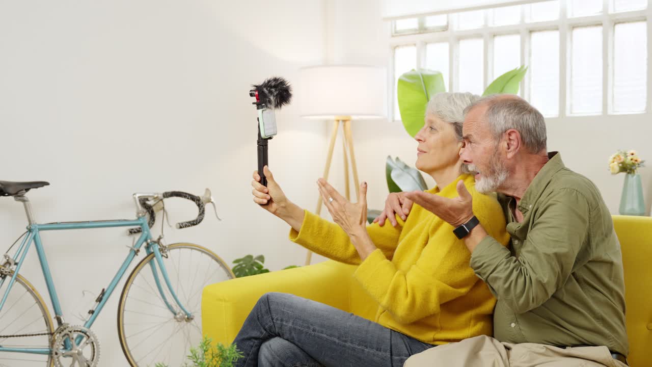 Senior couple vlogging at home