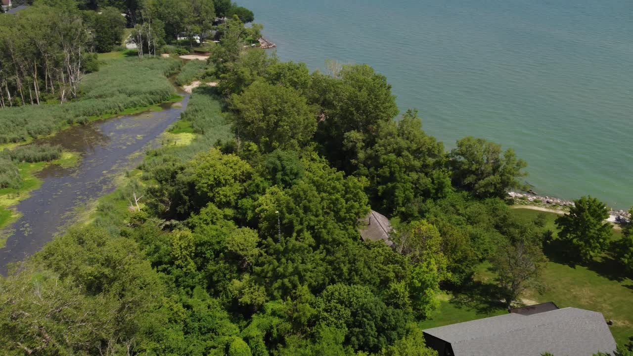 4K Aerial Drone Footage of Marshy Pond Flowing Into Lake Erie, Ontario