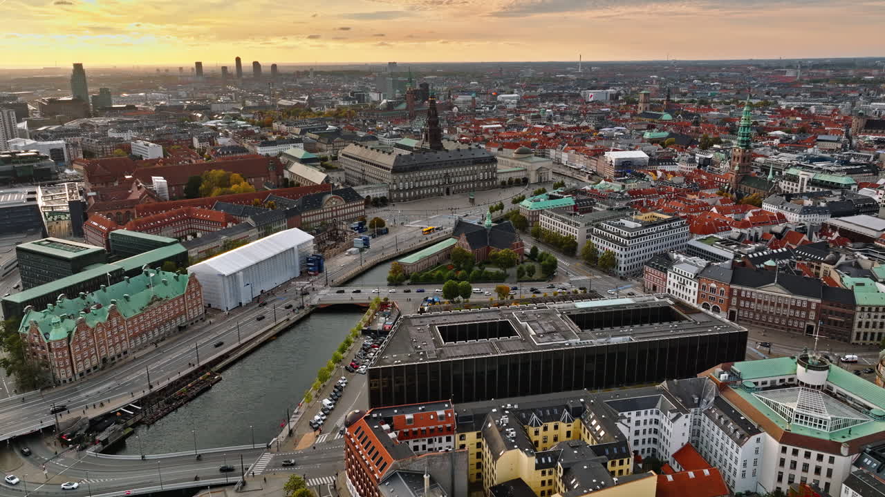 Aerial drone view of the Christiansborg Palace on the islet of Slotsholmen in central Copenhagen, Denmark at sunset
