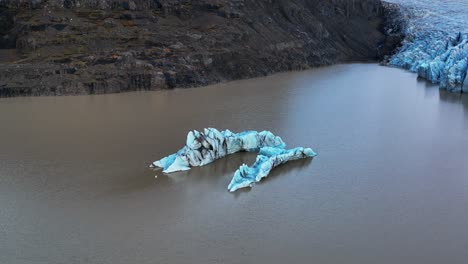 iceberg in lake with svinafellsjokull glacier outlet in south iceland revealed