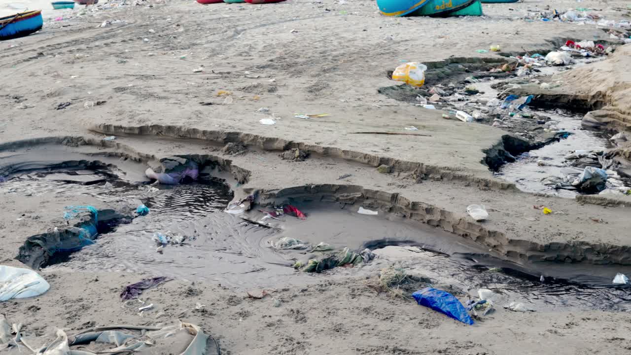 Excess plastic waste washed up on the shore line ina Vietnamese fishing village, Asia.
