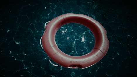 life buoy floating rescue ring on the sea water at night