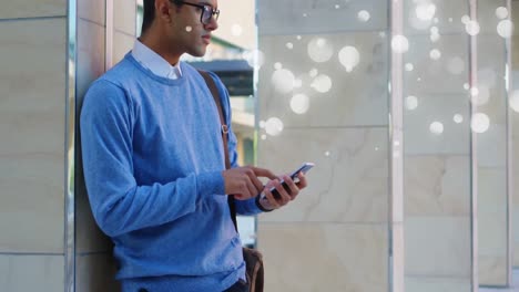 young man using his mobile phone surrounded by white bubbles effect