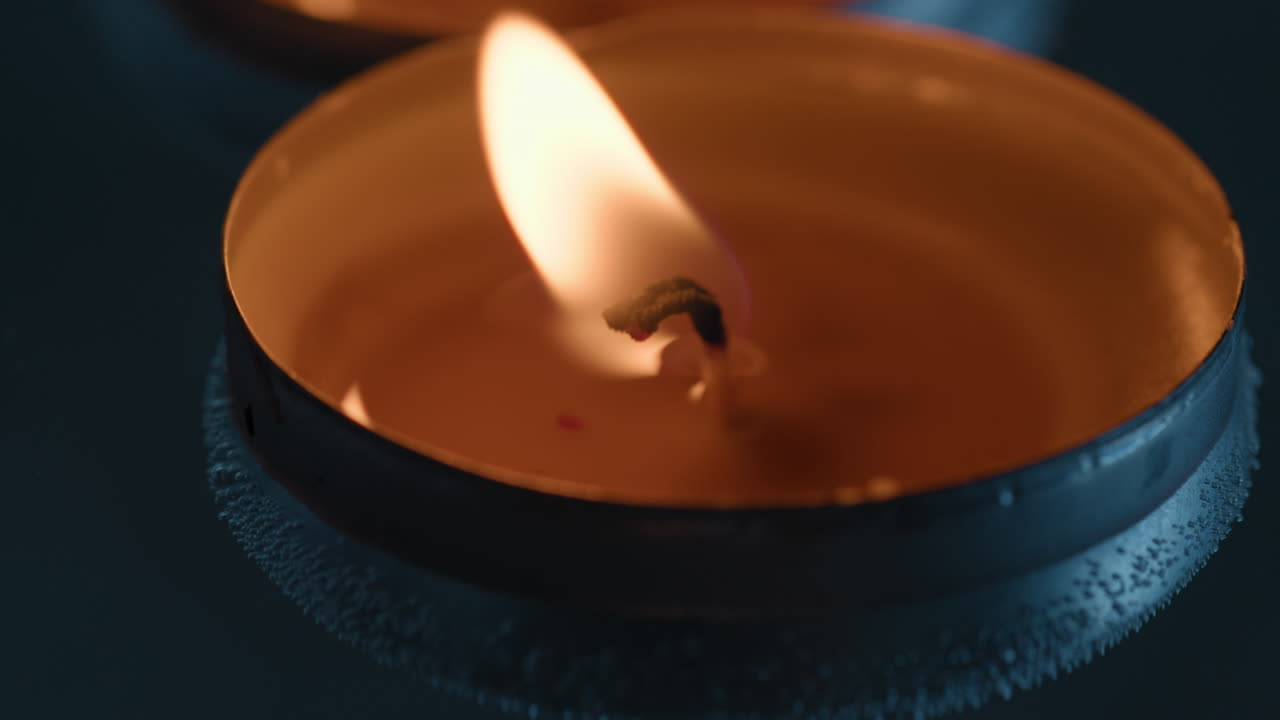 Small candle floating in water for Diwali celebration