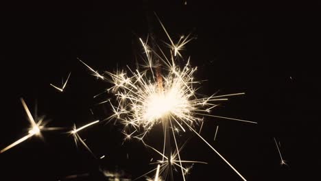 close-up of a sparkler on black background