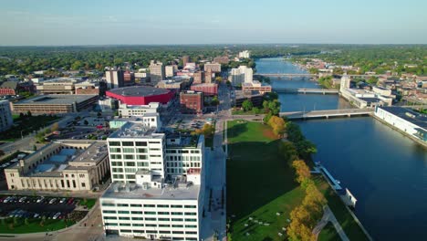 drone aerial shot of rockford, illinois, the camera follows the rock river, offering views of the cityscape