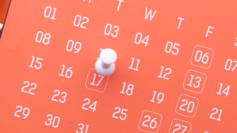 calendar with a pin marking a date