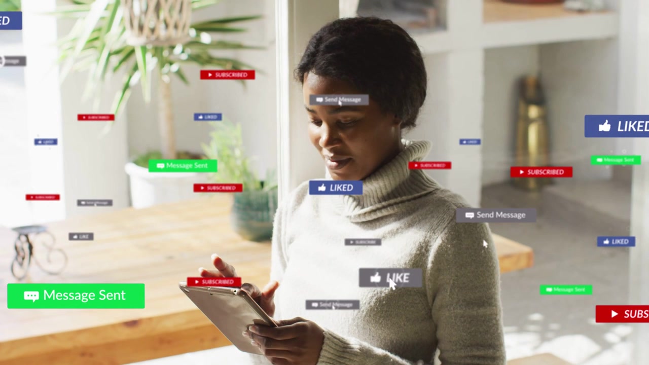 Woman looking down at tablet tapping and scrolling, causing social badges grouping for messaging