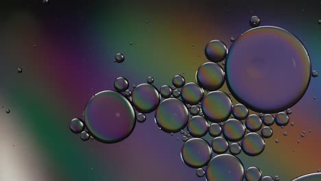 colorful artistic of oil drop floating on the water. abstract bubble backgrou