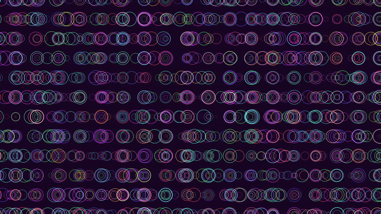 Abstract footage of colorful neon bokeh rings and glowing circle outlines drifting on a dark background, ideal for tech, music, party, and futuristic motion design