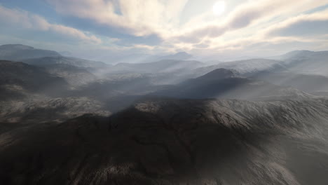 stunning aerial view of a mountain range with fog and clouds