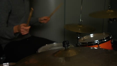 Man-playing-a-drums