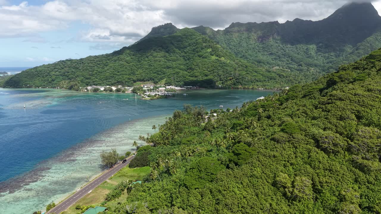 Aerial View of Moorea Island, French Polynesia.Green Hills, Coastal Road and Port