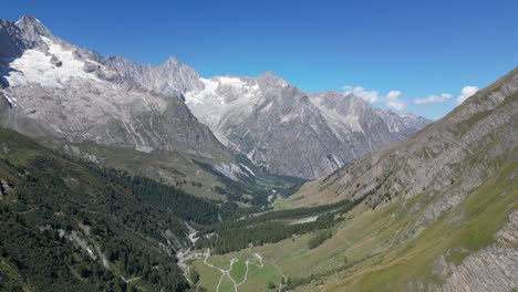 stunning drone footage of an alpine valley as a bird of prey flies close by