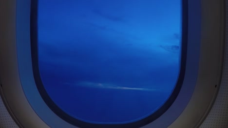 timelapse airplane window view pacific ocean view clouds and sunrise