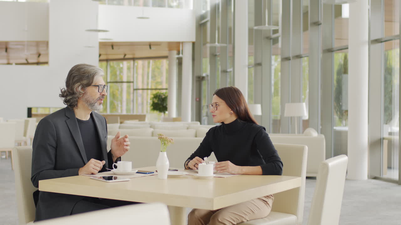 Business Partners Chatting At Restaurant