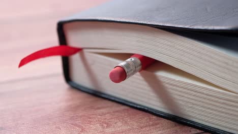 red pencil in an open book