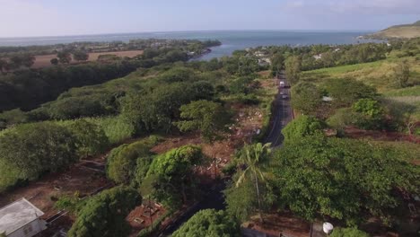 Flying-over-Mauritius-with-coastal-river-town-and-sugarcane-fields