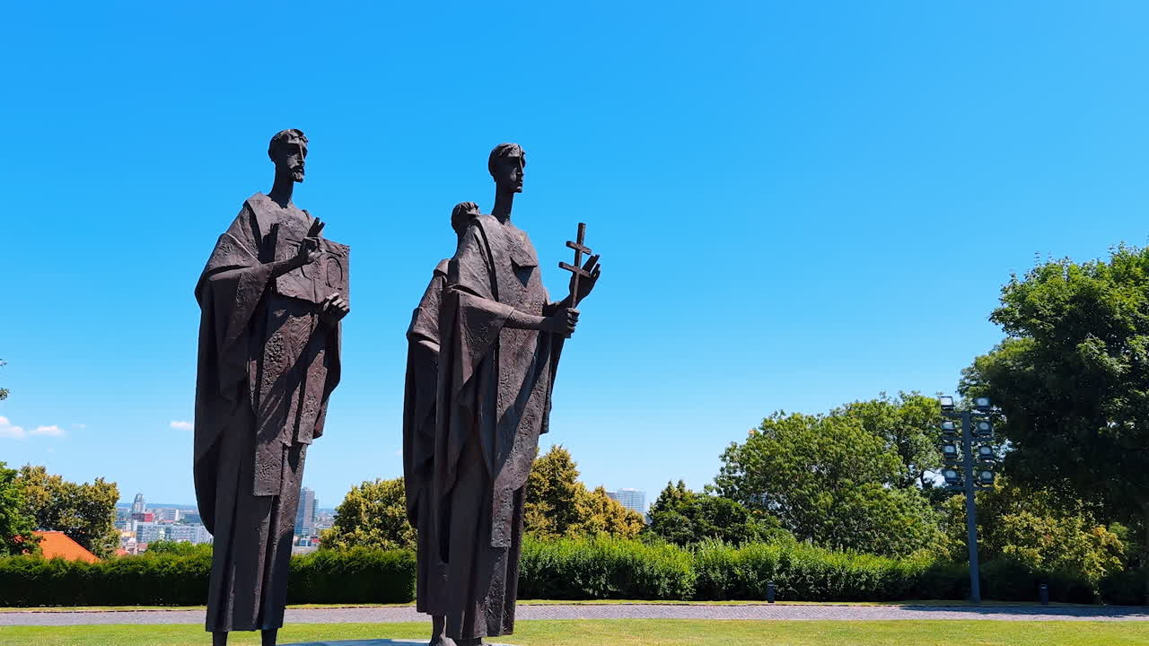Bratislava, Slovakia, 2 June 2025: Approaching the monument of three people. Sculpture of Saint Cyril, Methodius and Gorazd at the Bratislava Castle in Slovakia