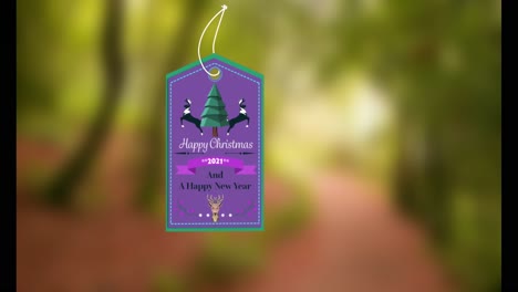 animación de la etiqueta de regalo con texto de felices navidades e iconos sobre un fondo borroso.