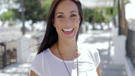 Laughing-brunette-posing-at-camera