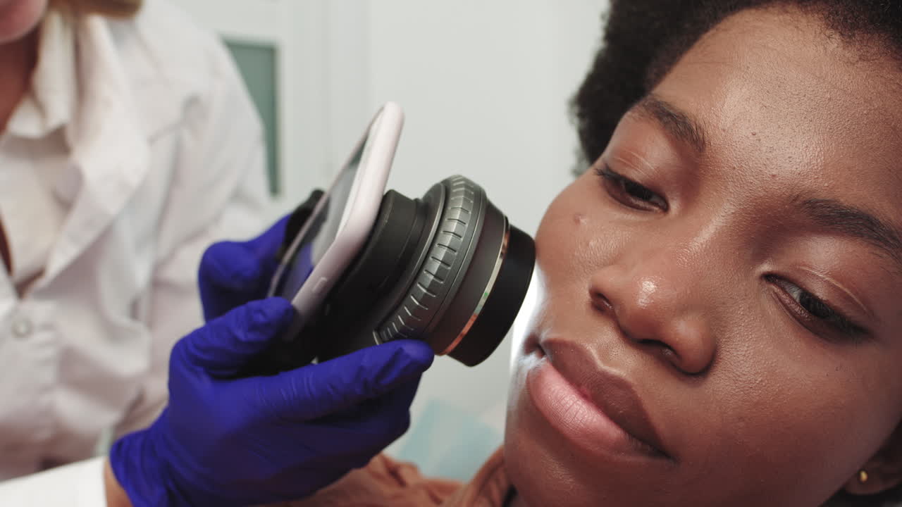 The doctor dermatologist examines a skin professional doctor the dermatologist research a birthmark