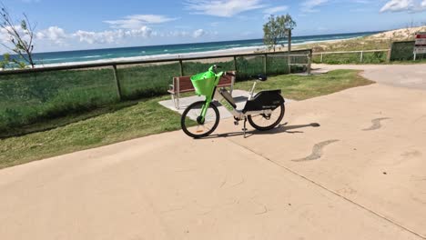 electric bike parked near seaside pathway