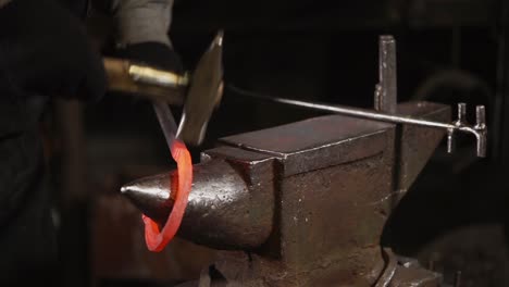 blacksmith forging a horseshoe