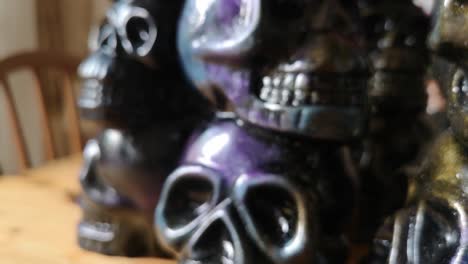 colourful painted ceramic spooky death skull totem crafts pottery ornament shallow focus pull back