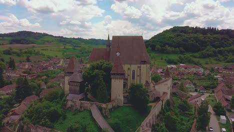 drone shot revealing biertan fortified church from above