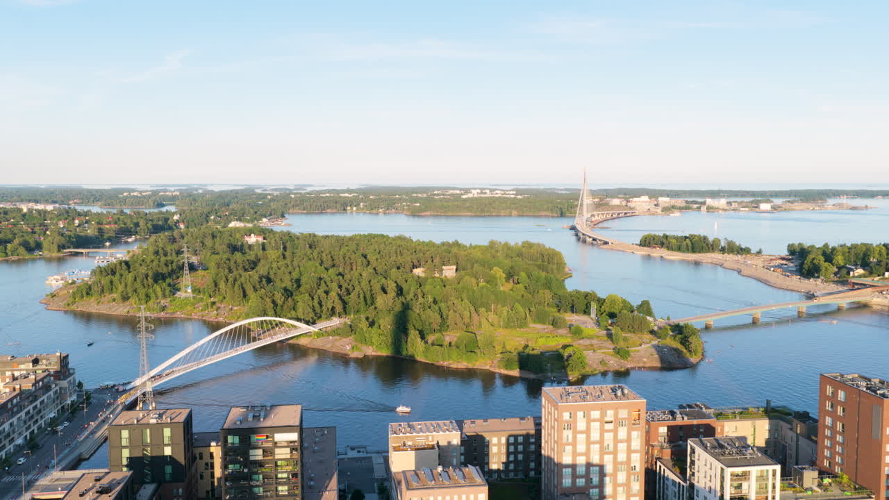 Aerial view circling the Mustikkamaa island, golden hour in Helsinki, Finland