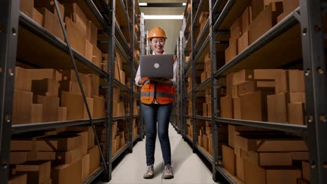 warehouse worker using laptop