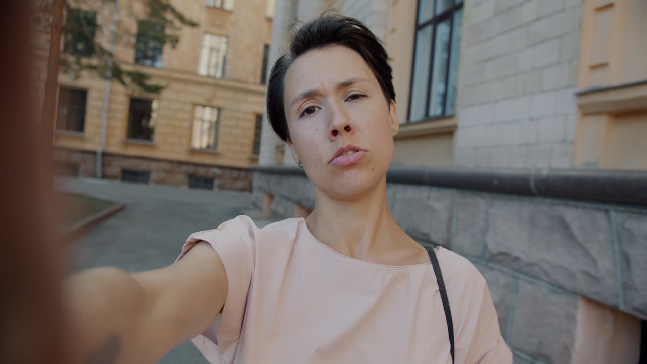Woman Taking a Selfie in an Urban Setting