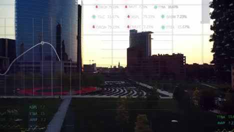 Animation-of-multiple-graphs-and-trading-boards-over-aerial-view-of-modern-buildings-against-sun