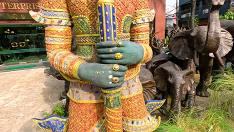 giant statue of a thai deity in a city