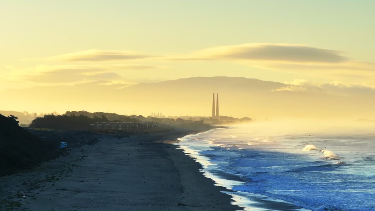 Moss Landing Powerplant Twin Towers golden yellow sunrise morning mist seafog Pajaro Dunes California aerial drone Santa Cruz Manresa Sunset State Beach waves Monterey Bay Pacific Ocean forward up